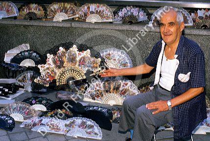 A street vendor selling fans in Madrid, Spain.