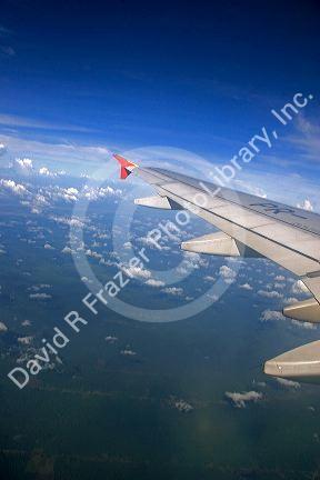 Airplane wing above the clouds.