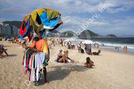 Vendor selling beach apparel at Copacabana Beach in Rio de Janeiro, Brazil.