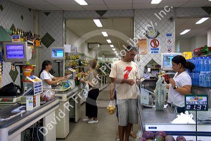 Customers in checkout lines at a supermarket in Rio de Janeiro, Brazil.