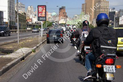 Autos and motorcycles in traffic at Sao Paulo, Brazil.