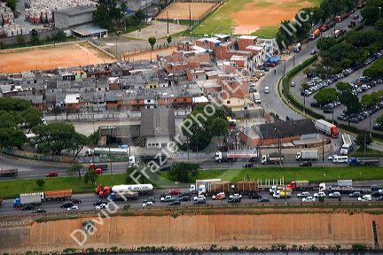 Aerial view of housing and traffic on highways in Sao Paulo, Brazil.
