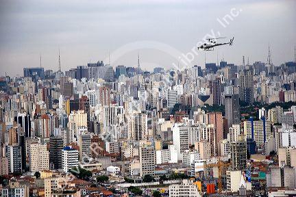 Aerial view of Sao Paulo and a helicopter in flight, Brazil.