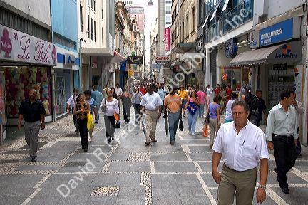 People and store fronts on a walking street in Sao Paulo, Brazil.