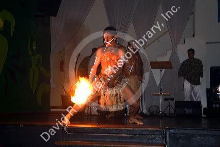 A man dances with fire at a nightclub in Sao Paulo, Brazil.