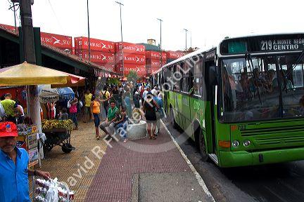 A public transportation bus and street vendors in Manaus, Brazil.