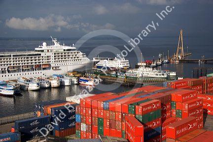 Cruise ships and containers on the Rio Negro at the port in Manaus, Brazil.