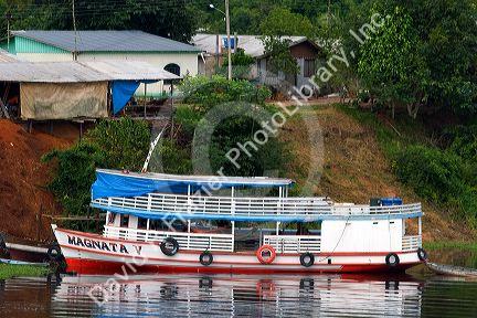 River boat docked on the Arasa River in the Amazon jungle near Manaus, Brazil.
