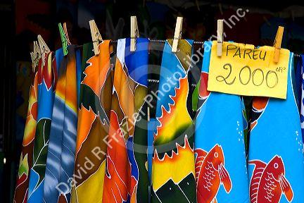 Colorful pareu wraps being sold at a market in Papeete on the island of Tahiti.
