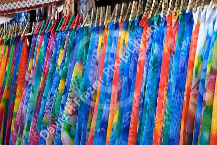 Colorful pareu wraps being sold at a market in Papeete on the island of Tahiti.