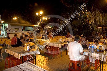 Outdoor dining at a plaza in Papeete on the island of Tahiti.