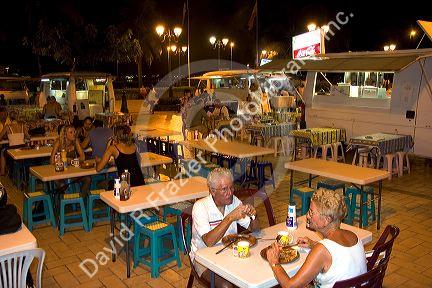 Outdoor dining at a plaza in Papeete on the island of Tahiti.