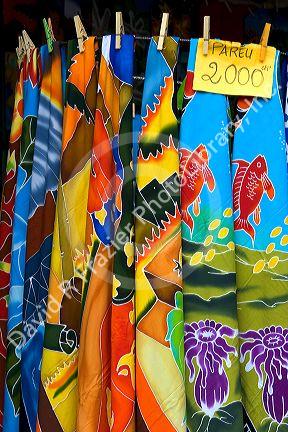 Colorful pareu wraps being sold at a market in Papeete on the island of Tahiti.