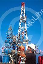 Man working on a Texas oil well.