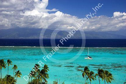 Sailboat anchored in the lagoon off the island of Moorea.