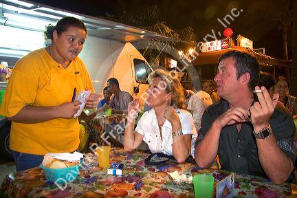 Outdoor dining at a plaza in Papeete on the island of Tahiti.
