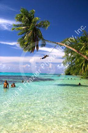 Tahitians swim and play in the lagoon on the island of Moorea.