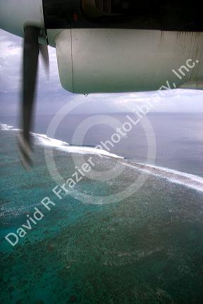 View of the lagoon surrounding Tahiti from a commuter aircraft.