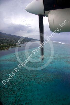 View of the lagoon surrounding Tahiti from a commuter aircraft.