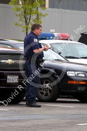 Police officer writing parking tickets in Washington, D.C.
