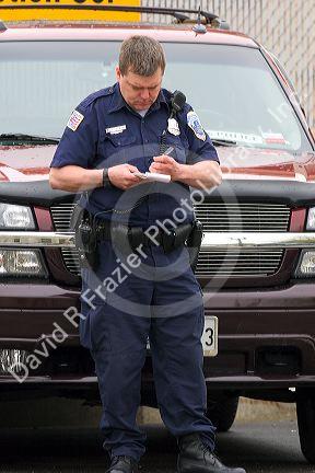 Police officer writing parking tickets in Washington, D.C.