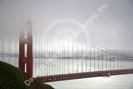 A view of the Golden Gate Brige with fog in San Francisco, California.