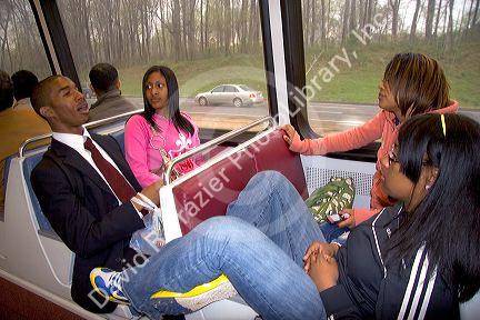 Young adults ride on the Metrorail System in Washington, D.C.