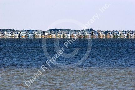 Heat waves and reflection cause distorted view of beach houses along the Cape Hatteras National Seashore.