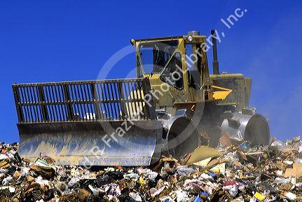 Bulldozer compacter working in a landfill in Boise, Idaho.