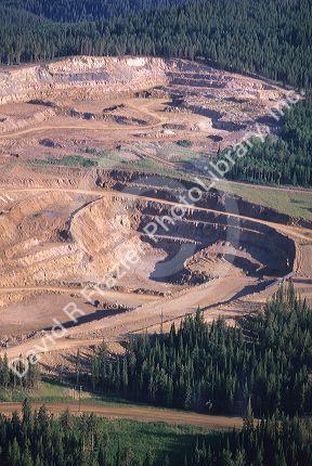 Open pit gold mine containing a cyanide leaching pond in Black Hills, South Dakota.