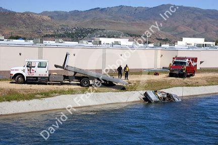 Fire department divers pull a car from an irrigation canal in Boise, Idaho.