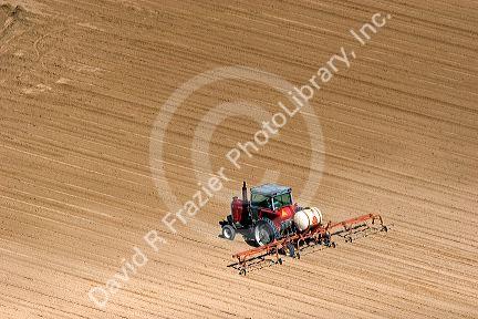 Aerial view of a tractor being used to spray a field in Canyon County, Idaho.