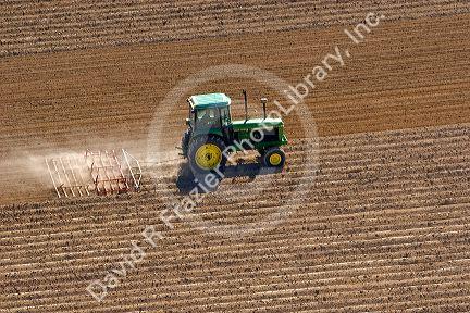 Aerial view of a tractor tilling a field in Canyon County, Idaho.