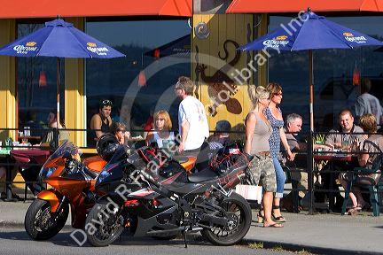 People dine on the outdoor patio of an Alki Point restaurant in Seattle, Washington.