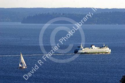 Washington State Ferry Boat and sail boat in Elliott Bay at Seattle, Washington.
