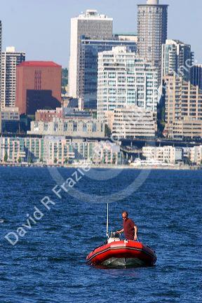 Zodiac boat in Elliott Bay with the city of Seattle, Washington in the background.