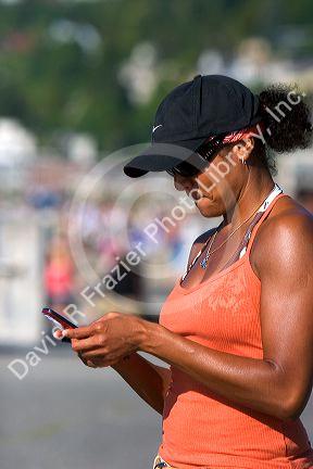African american woman text messaging on her cell phone in Seattle, Washington. MR