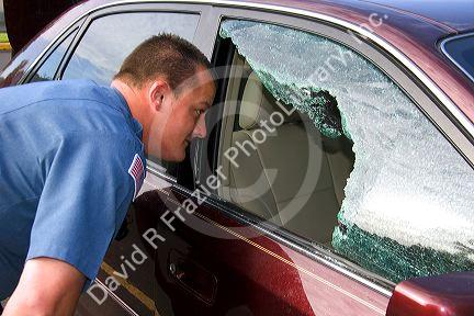 Police officer investigating a car burglary in Oregon.