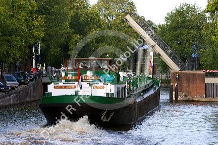Canal boat on the Amstel River in Amsterdam, Netherlands.