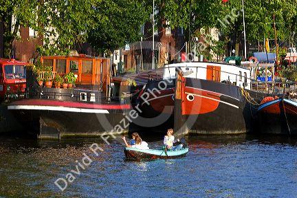 Boating on the Amstel River in Amsterdam, Netherlands.