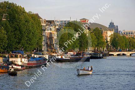 Boating on the Amstel River in Amsterdam, Netherlands.