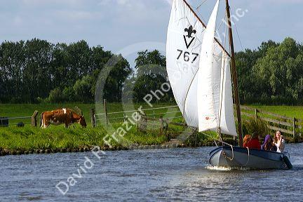 Sailing on a canal east of Leiden in the province of South Holland, Netherlands.