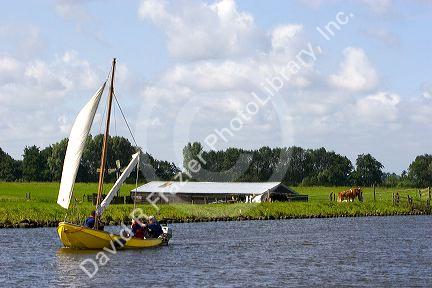 Sailing on a canal east of Leiden in the province of South Holland, Netherlands.