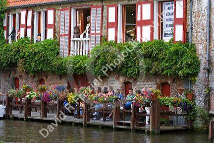 People await a boat tour on a canal in the city of Bruges in the province of West Flanders, Belgium.