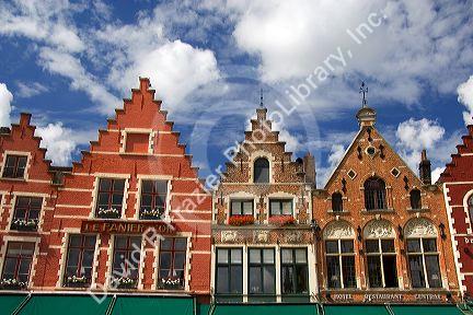 Colorful building facades in The Big Market Square at Bruges in the province of West Flanders, Belgium.