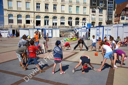 Children play an organized game of ball in the village of Wimereux in the department of Pas-de-Calais, France.