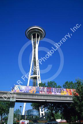 The monorail in Seattle, Washington travels in front of the Space Needle.