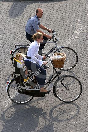 A family riding bicycles at The Hague in the province of South Holland, Netherlands.