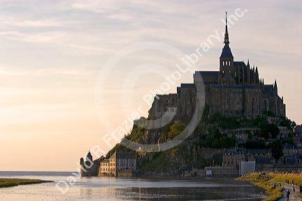 Le Mont Saint Michel at sunset in the region of Basse-Normandie, France.
