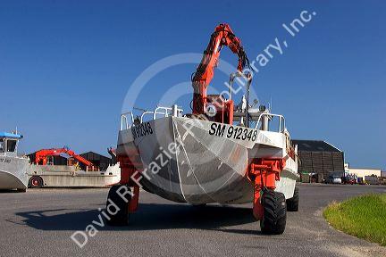 Amphibious boat used for havesting mussels from the bay along the emerald coast near Saint-Martin-du-Viver in the region of Haute-Normandie, France.